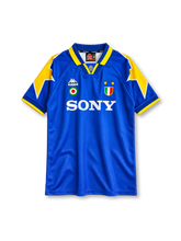 Juventus 1995-96 away jersey, front view, royal blue body, yellow star graphics on shoulders and sleeves, blue polo collar with yellow trim, small Juventus crest at collar insert, Kappa logo and Coppa Italia cockade on right chest, scudetto shield with two gold stars on left chest, white SONY sponsor logo, blue cuffs with yellow edging