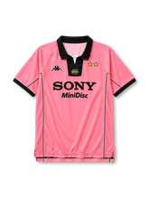 Juventus 1997-98 away jersey, front view, pink body, black polo collar with white V-notch, yellow centenary 100 emblem on collar insert, Kappa logo on right chest, two gold stars on left chest, black SONY MiniDisc sponsor logo, mesh side panels with black and white piping, black cuffs, split side vents