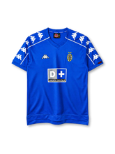 Juventus 1999-00 away jersey, front view, royal blue body, V-neck collar, repeating white Kappa logo bands on shoulders and sleeves with white piping, Kappa logo on right chest, oval Juventus crest with two gold stars on left chest, D+ Liberta Digitale sponsor logo, red Kappa tab on left cuff, stepped hem