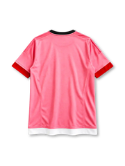 Juventus 2015-16 away jersey, front view, pink body, black crew neck collar, black three stripes on shoulders, red cuffs, black adidas logo on right chest, Juventus crest with three gold stars on left chest, white and red chest band with black JEEP sponsor panel, white hem band