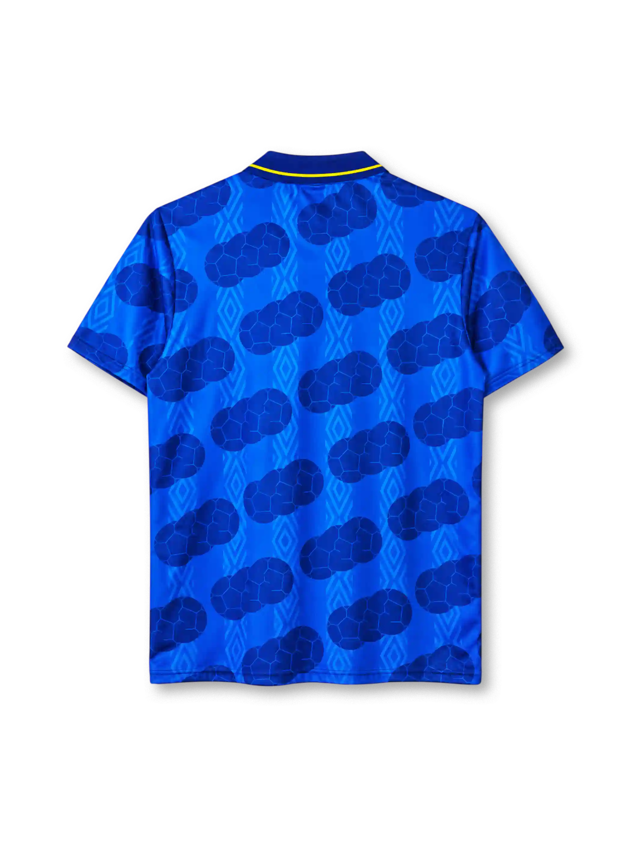 Colombia 1994 away jersey, front view, royal blue body with tonal diamond pattern and darker football-panel print, navy polo collar with yellow tipping and V insert, yellow UMBRO wordmark on right chest, Colombian Football Federation crest on left chest