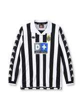 Juventus 1999-00 home long sleeve jersey, front view, black and white vertical stripes, white polo collar with black V insert, long sleeves with repeating white Kappa logos on black panels, black ribbed cuffs, Kappa logo on right chest, oval Juventus crest with two gold stars on left chest, D+ Liberta Digitale sponsor logo