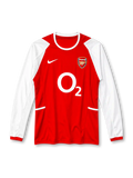 Arsenal 2002-04 home long sleeve jersey, front view, red body, white raglan long sleeves with mesh panels, white crew neck collar, red ribbed cuffs, white Nike swoosh on right chest, Arsenal cannon crest on left chest, white O2 sponsor logo, white side tabs