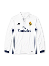 Real Madrid 2016-17 home long sleeve jersey, front view, white body, white polo collar with two-button placket, navy three stripes down both sides, white long sleeves with navy ribbed cuffs, black adidas logo on right chest, full-colour Real Madrid crest on left chest, navy FLY EMIRATES sponsor lettering