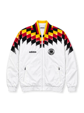 Front view of the Germany 1994 retro adidas track jacket in white with black, red, and yellow geometric shoulder graphics, a black DFB crest, adidas wordmark, high collar, full-length zipper, and elasticated cuffs.