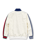 Front view of the off-white adidas x Gucci track jacket featuring blue Three Stripes on the left sleeve, Gucci red and green Web stripes on the right sleeve, a navy stand-up collar, co-branded adidas Trefoil and Gucci chest logo, full-length zipper, and front patch pockets.