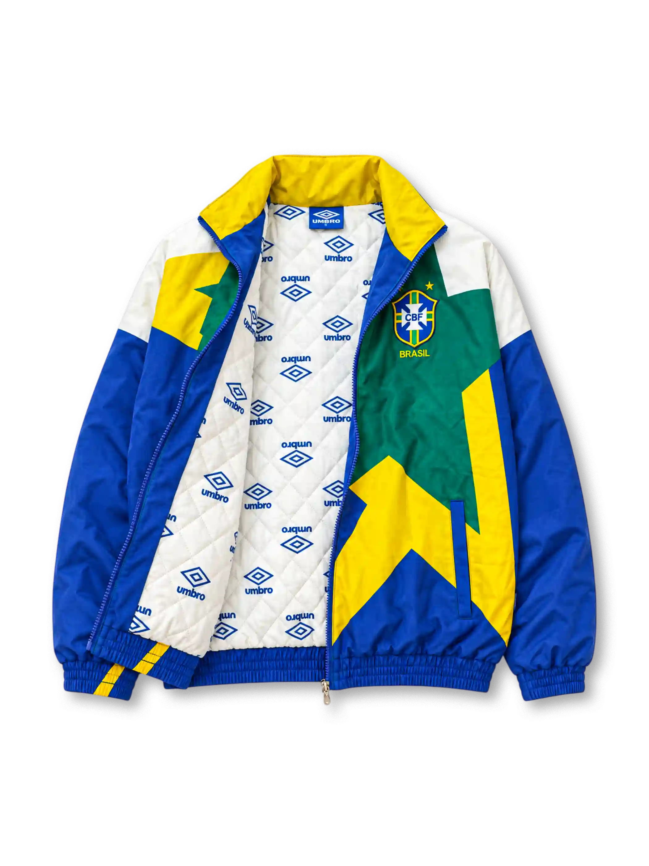 Front view of the Brazil 1993-94 Umbro national team track jacket featuring a large geometric star graphic in yellow and green, royal blue sleeves, white shoulder panels, an embroidered CBF crest, Umbro logo, full zip closure, and elasticated cuffs and hem.