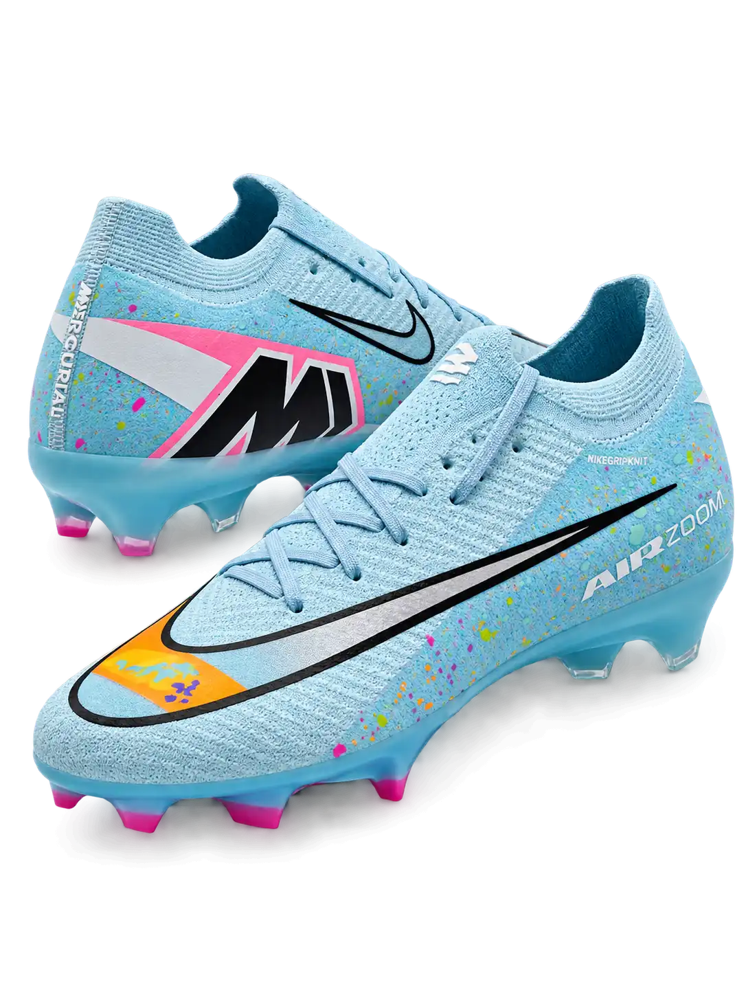 Nike Mercurial FG soccer cleats in light blue with multicolor confetti speckles, a black-outlined silver Swoosh, an orange painted toe graphic, an oversized M heel logo, and pink-tipped studs, shown as a pair.