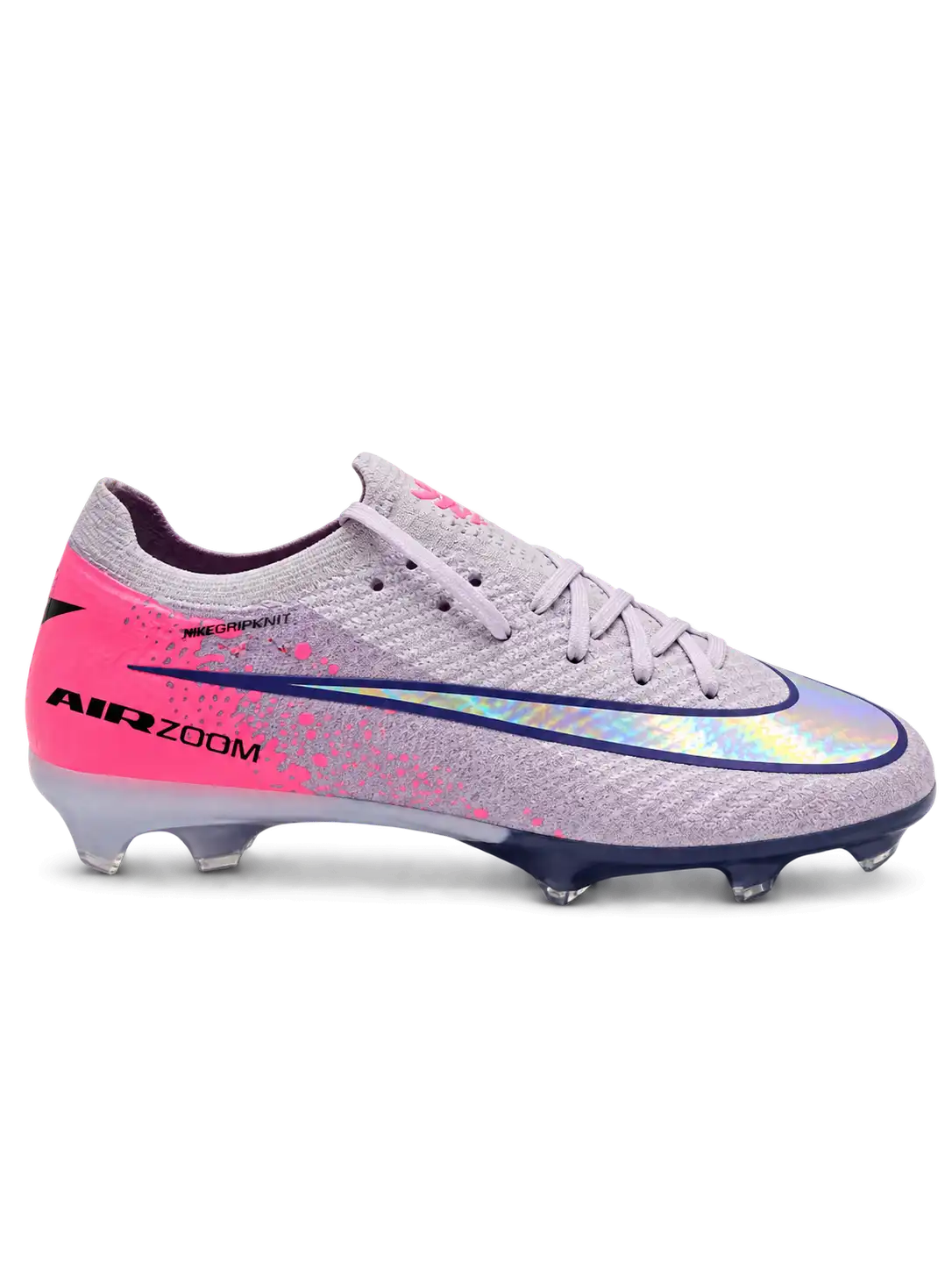 Nike Mercurial FG soccer cleats in lilac with a pink heel panel, pink paint-splatter accents, a navy-outlined holographic Swoosh, and Air Zoom heel lettering, plus a navy soleplate with a blue Air Zoom window, shown from the lateral side and outsole.