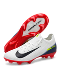 White Nike Mercurial-style FG soccer cleats with black Swoosh, navy gradient heel, neon yellow MERCURIAL lettering, and glossy red AIR ZOOM-branded outsole.