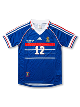 Front view of France 1998 World Cup home shirt in blue with white chest stripes, red trim, tournament print, and number 12 on the front.