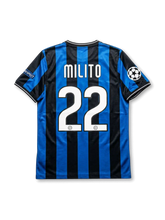 Inter Milan Nike 2009/10 Champions League Final Madrid home jersey in blue and black stripes with UCL starball patches, Final Madrid 2010 Bernabéu commemorative patch, Coppa Italia shield, Inter crest, Pirelli sponsor