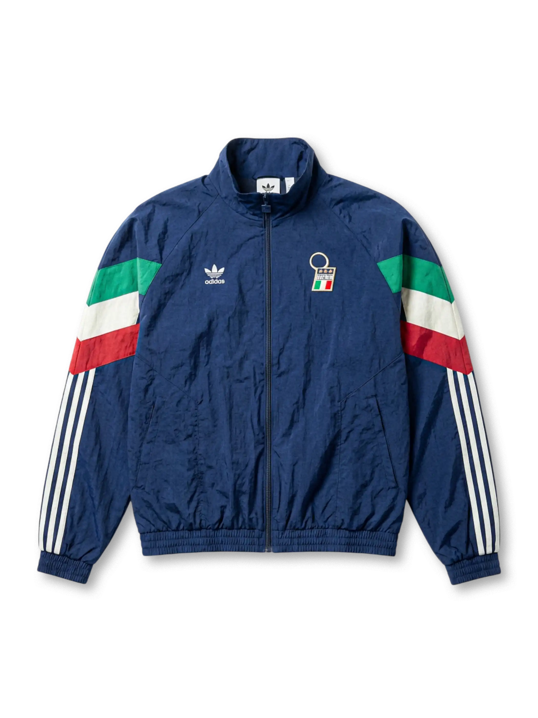Italy national team adidas Originals 1994 retro track jacket in navy with tricolor flag sleeve panels, FIGC crest at chest, Trefoil logo, and Three Stripes on sleeves