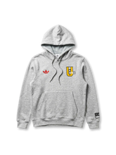Manchester United adidas Originals grey marl collegiate hoodie with red Trefoil at left chest, yellow MAN UNITED shield badge at right chest, and co-branded woven label at sleeve
