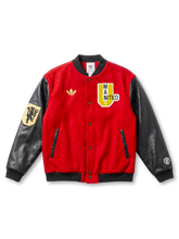 Manchester United adidas Originals varsity jacket in red wool with black leather sleeves, gold Trefoil at left chest, MAN UNITED collegiate shield patch at right chest, red devil embroidered patch on left sleeve
