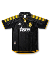 Front view of Real Madrid 1999-2000 away shirt in black with yellow trim, Teka sponsor, adidas logo, club crest, and polo collar.