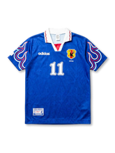 Front view of Japan 1997-98 home shirt with blue body, flame sleeve graphics, JFA crest, and #11 front number.