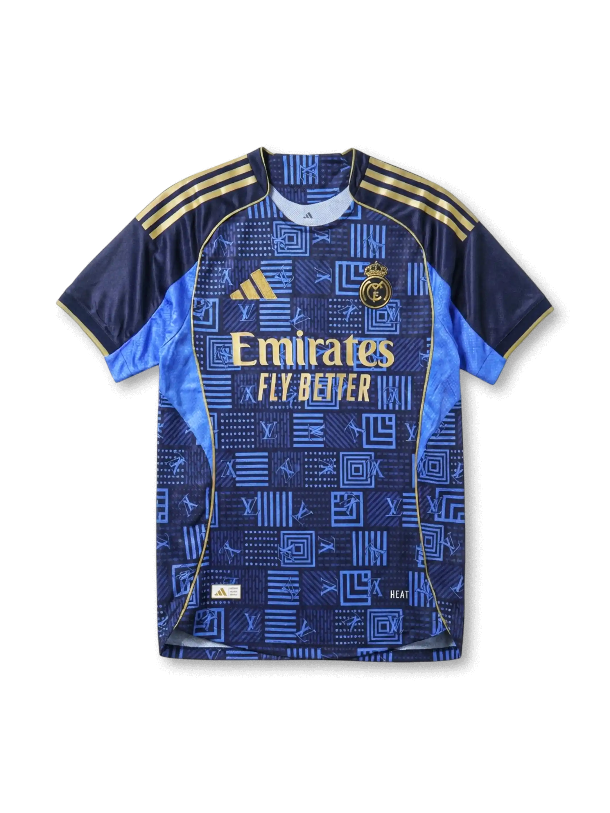 Real Madrid × adidas × Louis Vuitton away jersey in navy with LV geometric monogram patchwork print, sky blue side panels, gold Three Stripes on shoulders, gold adidas logo at left chest, gold Real Madrid crest at right chest, Emirates gold sponsor