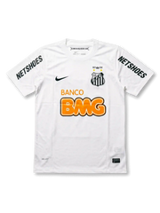 Front view of Santos 2012 centenary home shirt in white with Banco BMG sponsor, black swoosh, anniversary crest, and NETSHOES sleeve print.