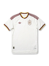 Spain national team adidas 2026 World Cup Authentic (Player Issue) away jersey in white with burgundy Three Stripes, gold-tipped crew collar, Trefoil at left chest, single-star RFEF heraldic crest at right chest, burgundy and gold sleeve cuffs