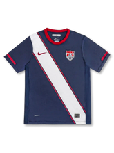 USA national team Nike 2010 World Cup away jersey in navy with wide diagonal white and red sash across front body, red crew collar, red Swoosh at left chest, US Soccer shield crest at right chest