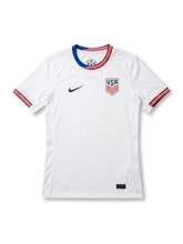 USA national team Nike 2024/25 home jersey in white with tonal vertical pinstripe texture, ONE NATION tricolor layered crew collar in red, white, and blue, navy Swoosh at left chest, USA shield crest at right chest, red and blue sleeve cuff bands