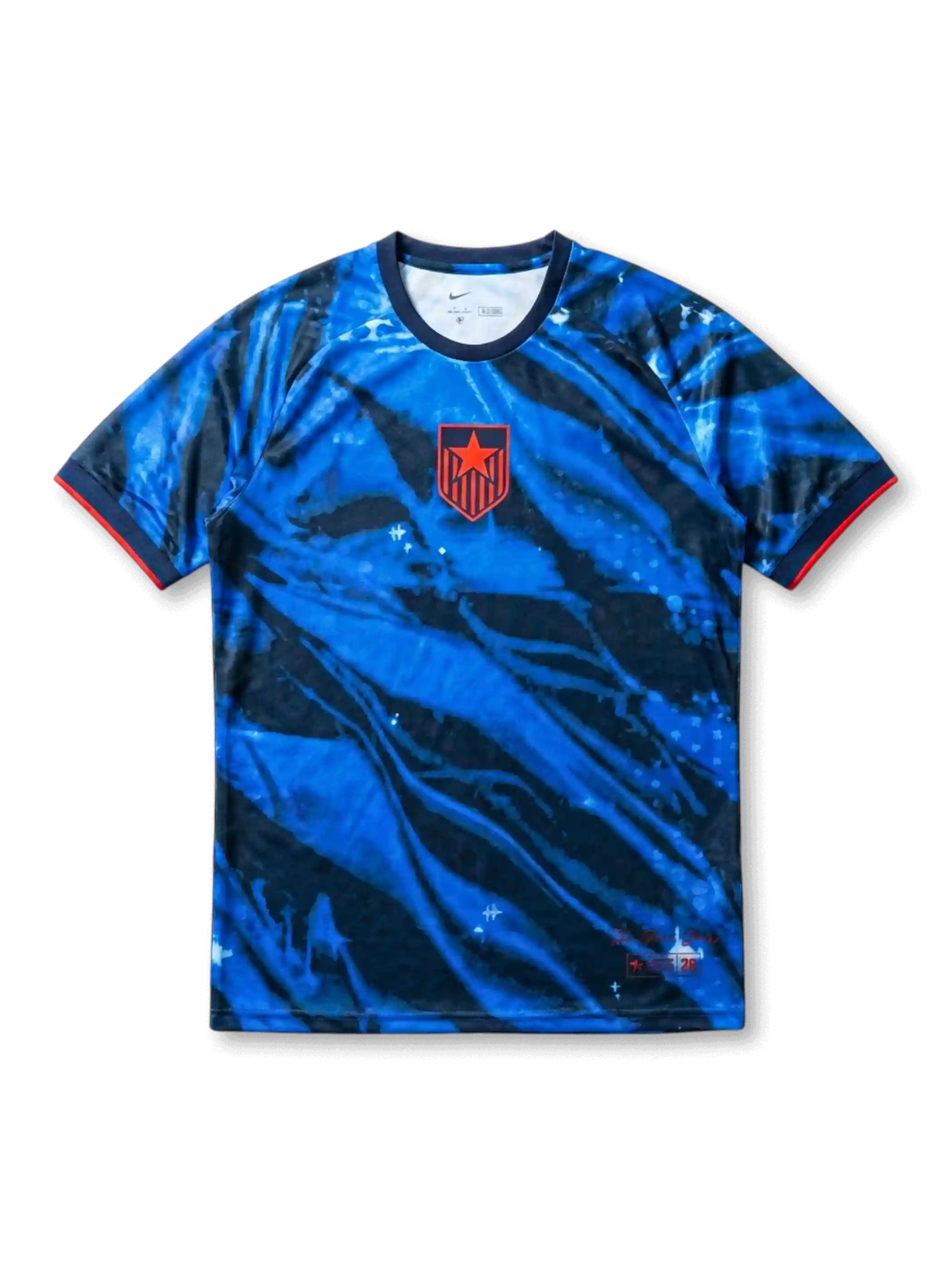 USA national team Nike 2028 Los Angeles Olympics Special Edition Authentic (Player Issue) jersey with royal blue and navy tie-dye marble allover print, red alternate star-shield crest at left chest, navy crew collar, red sleeve cuff bands, LA 2028 tournament designation at lower hem