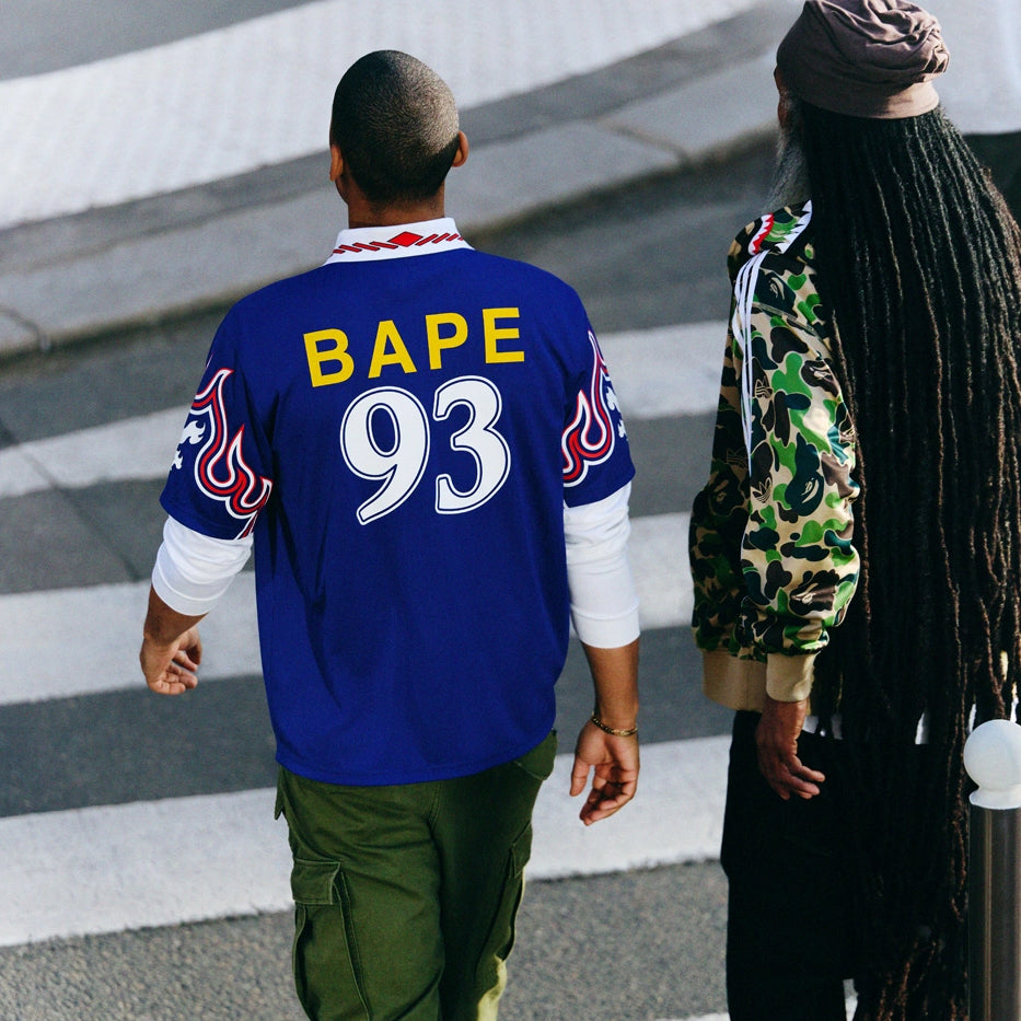 Harajuku's ape storms the pitch. adidas × BAPE football jersey "93" in royal blue.

