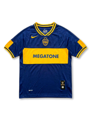 Front view of Boca Juniors 2001-02 home shirt with navy blue body, gold chest band, Megatone sponsor, Boca Juniors crest, and Nike detailing.