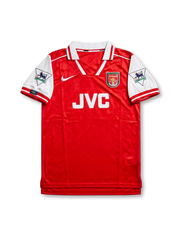 Front view of Arsenal 1995-96 home shirt with red body, white sleeves, JVC sponsor, club crest, and Premier League sleeve patches.