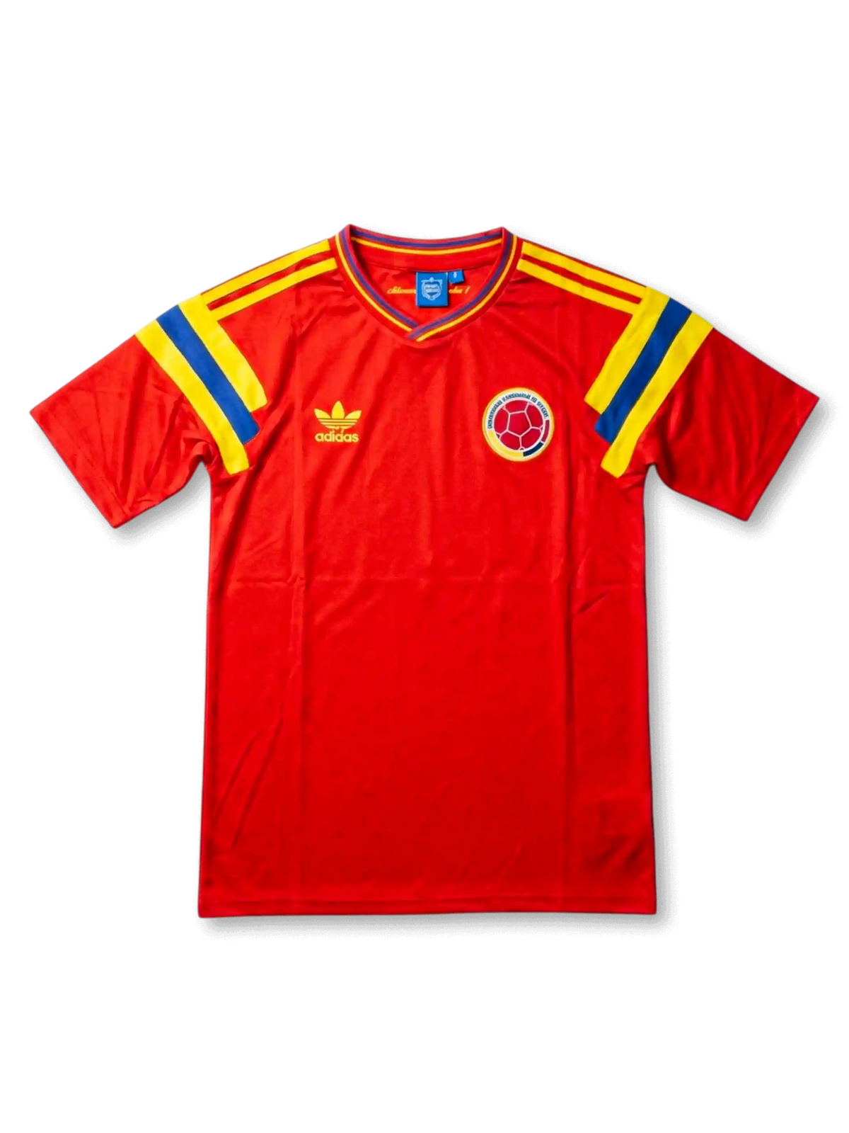 Front view of Colombia 1990 away shirt with red body, yellow and blue shoulder stripes, V-neck collar, and Colombia crest.