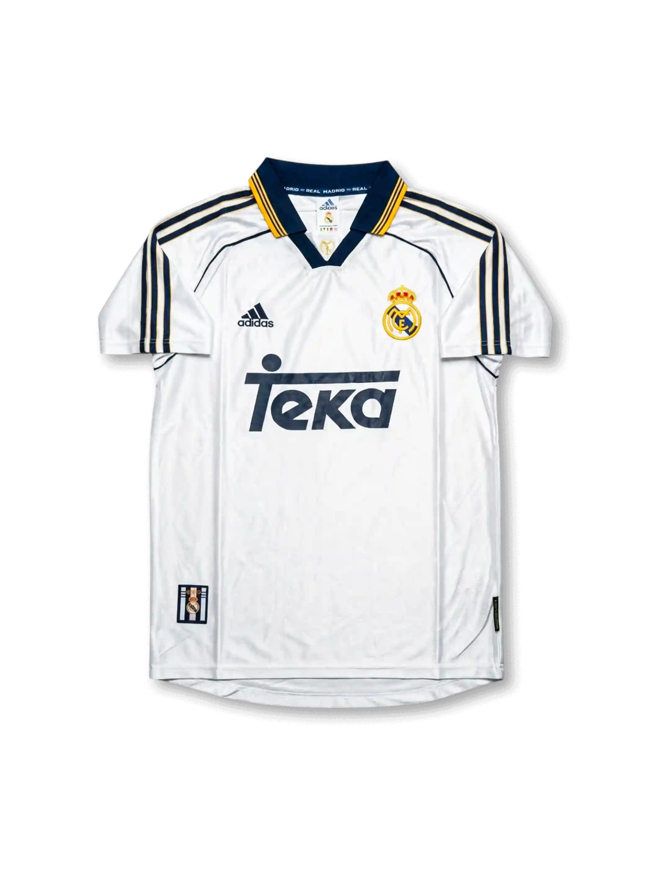 Front view of Real Madrid 1998-00 home shirt with white base, Teka sponsor, navy-and-gold collar trim, adidas logo, and club crest.