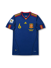 Front view of Spain 2010 World Cup Final away shirt with navy body, Spain crest, #6 chest number, South Africa 2010 sleeve patch, and Netherlands-Spain final embroidery.