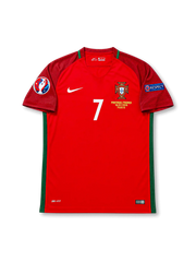 Front view of Portugal 2016 Euro Final home shirt with red body, Portugal crest, #7 chest number, Paris final embroidery, UEFA Euro 2016 patch, and Respect sleeve patch.
