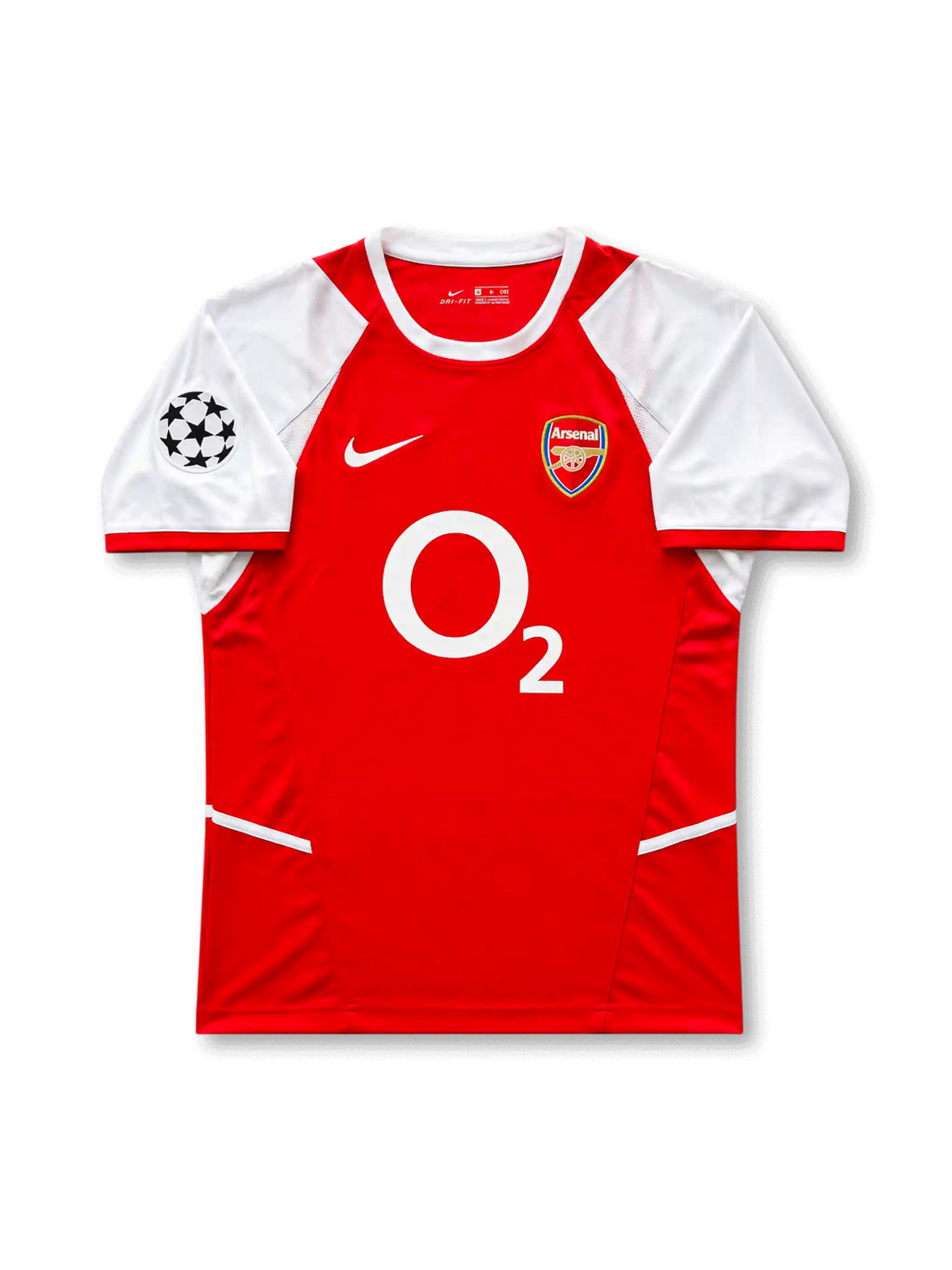 Front view of Arsenal 2002-04 home shirt with red body, white sleeves, O2 sponsor, Arsenal crest, and UEFA Champions League sleeve patch.