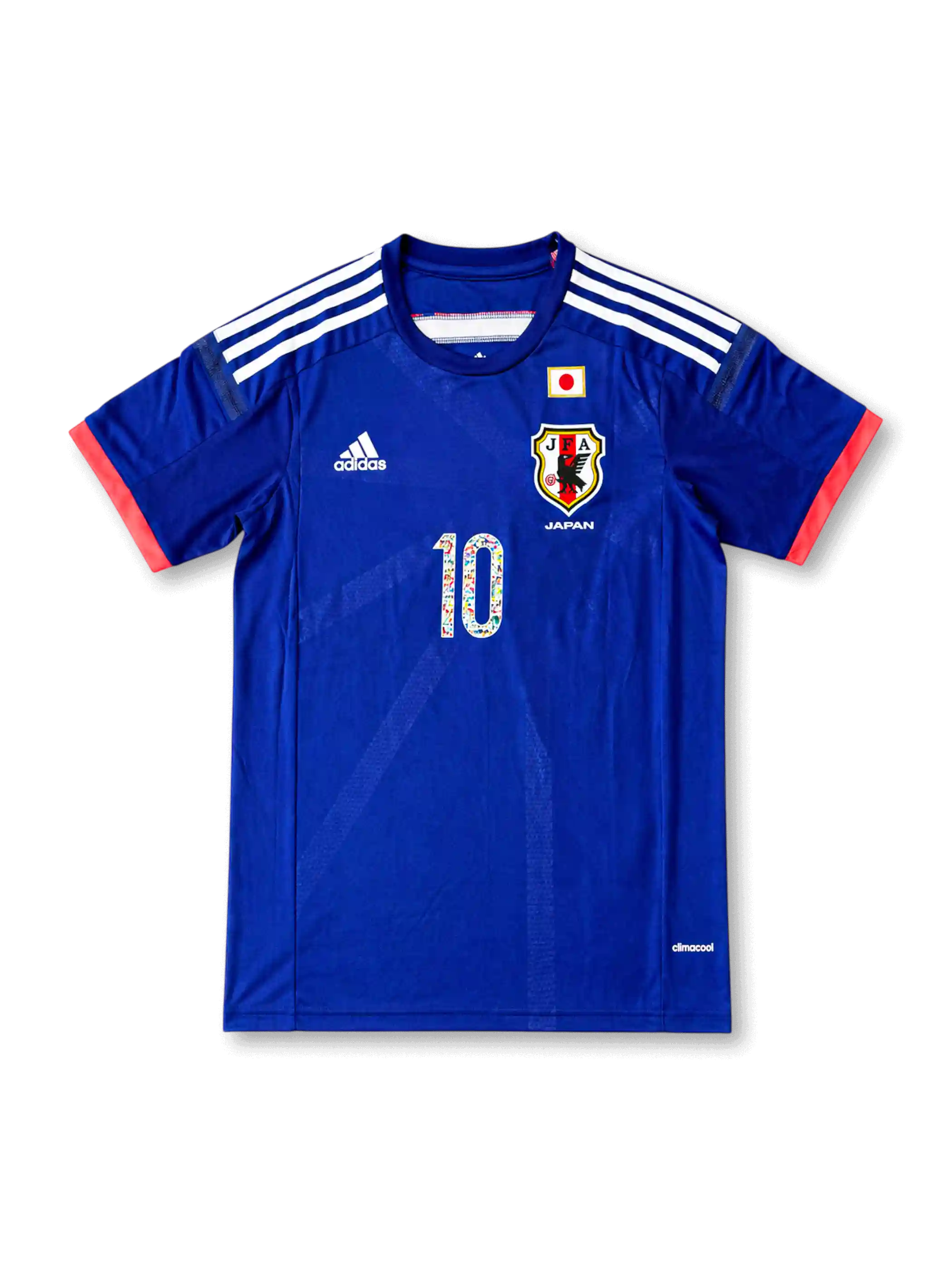 Front view of Japan 2014 Captain Tsubasa home shirt with blue body, Japan crest, national flag detail, #10 manga-style chest number, and coral sleeve trim.