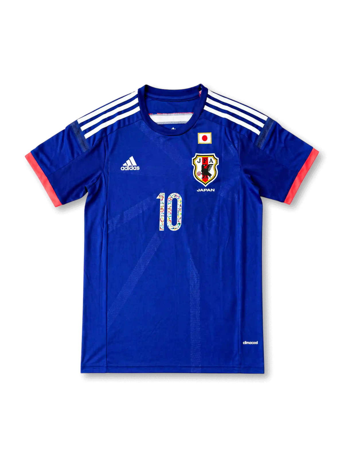 Front view of Japan 2014 Captain Tsubasa home shirt with blue body, Japan crest, national flag detail, #10 manga-style chest number, and coral sleeve trim.
