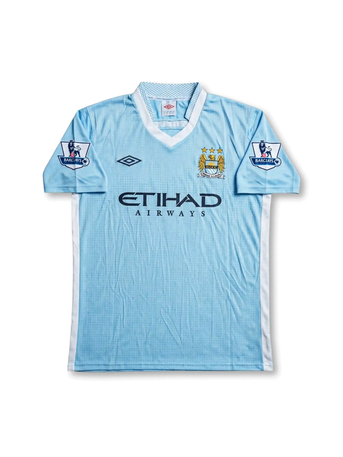 Front view of Manchester City 2011-12 home jersey with sky blue body, Etihad Airways sponsor, club crest, and Barclays sleeve patches.