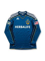 Front view of LA Galaxy 2007-08 away jersey in teal long sleeve design with Herbalife sponsor, MLS patch, U.S. flag patch, and club crest.