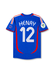 Back view of France 2006 World Cup home shirt with Henry name and #12 printing, red curved side panels, royal blue base, and Germany 2006 sleeve patch.