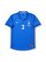 Front view of Italy 1998 World Cup home shirt with blue base, Italy crest, central #3 print, France 98 tournament detail, white sleeve trim, and polo-style collar.