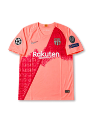 Front view of Barcelona 2018-19 third shirt with coral pink base, red diagonal graphic, Barcelona crest, Rakuten sponsor, and Champions League sleeve patches.