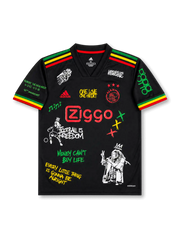 Front view of Ajax 2021-22 Bob Marley special edition shirt with black base, red yellow and green shoulder stripes, Ajax crest, Ziggo sponsor, and reggae-inspired graphic artwork.