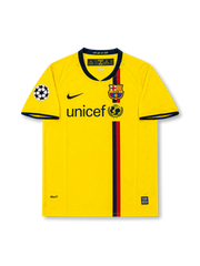 Front view of Barcelona 2008-09 away shirt with yellow body, central red and navy stripe, club crest, UNICEF sponsor, and Champions League sleeve patch.