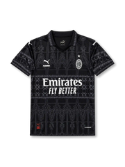 AC Milan special edition black jersey with tonal gothic graphics, polo collar, Puma logos, Emirates Fly Better sponsor, PLEASURES detail, and wefox back sponsor