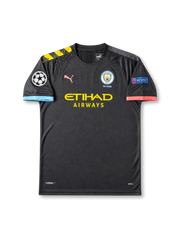 front view of Manchester City 2019-20 away shirt with dark charcoal base, Etihad Airways sponsor, 125 Years crest, Puma logo, Champions League patch, and UEFA Respect sleeve patch