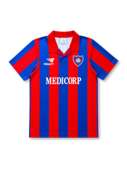 front view of San Lorenzo 1994 home shirt with red and blue vertical stripes, Medicorp sponsor, Penalty branding, club crest, and red collar