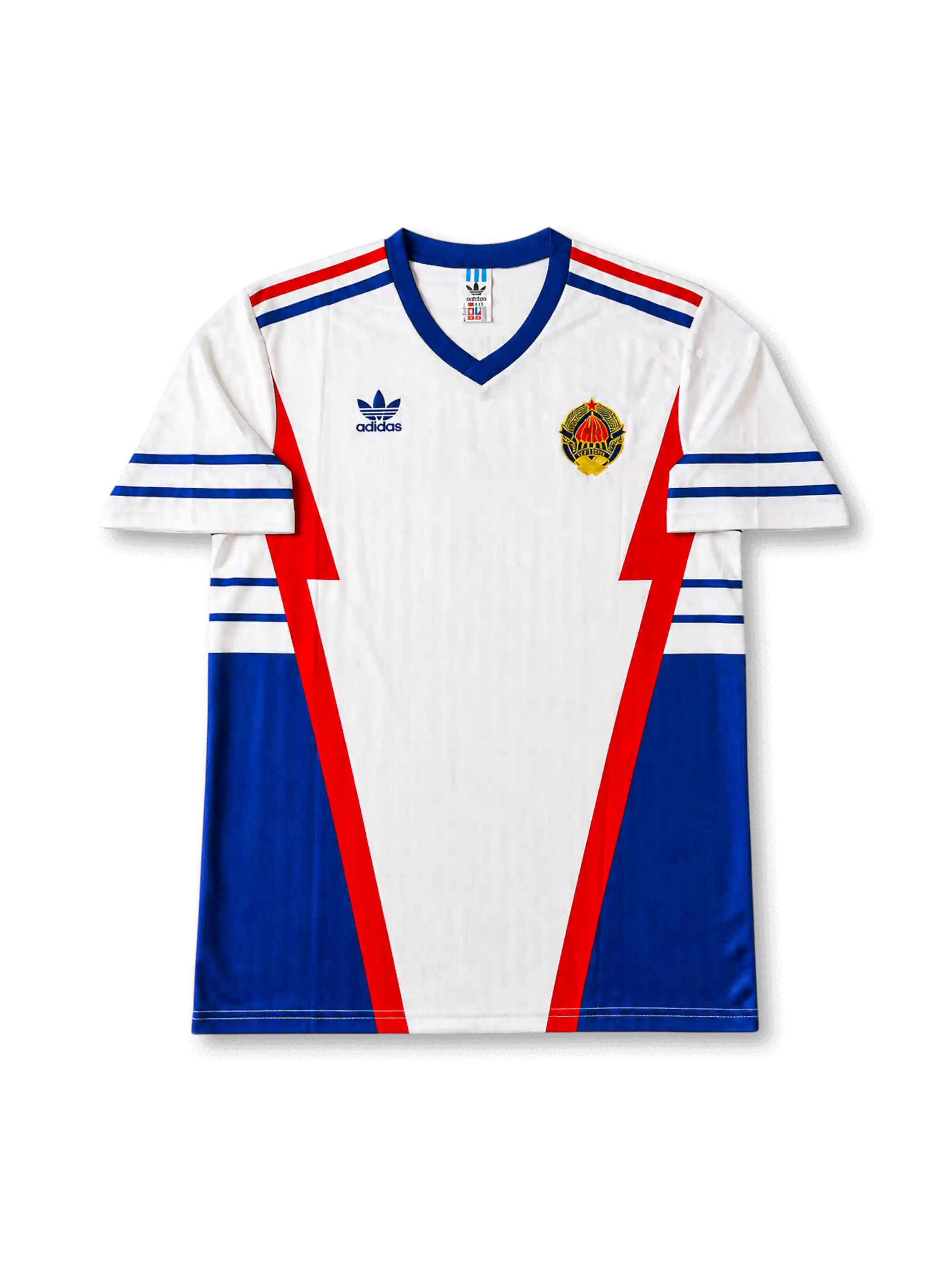 front view of Yugoslavia 1998 World Cup away shirt with white base, blue side panels, red geometric details, adidas trefoil logo, and national crest