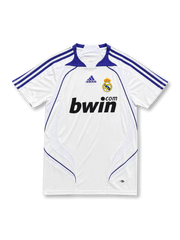 front view of Real Madrid 2007-08 home shirt with white body, purple adidas stripes, bwin sponsor, club crest, and ClimaCool detailing