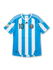 front view of Argentina 2010 World Cup home shirt with sky blue and white stripes, black number 10, Argentina crest, adidas logo, and South Africa 2010 sleeve patch